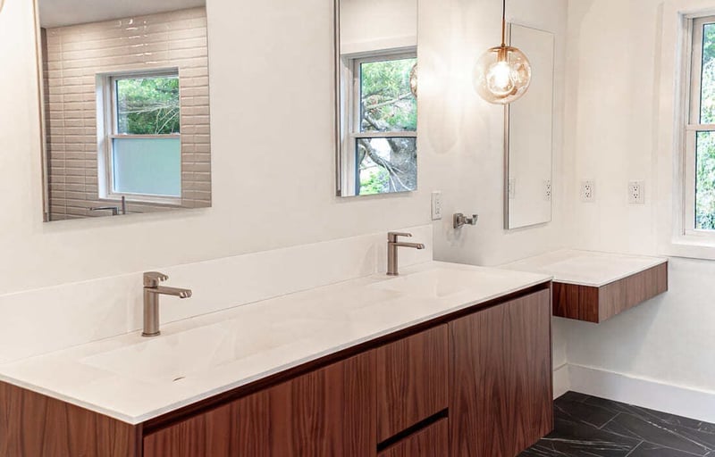 Floating canity with flat panel cabinets in Boston bathroom remodel by Honorato Company