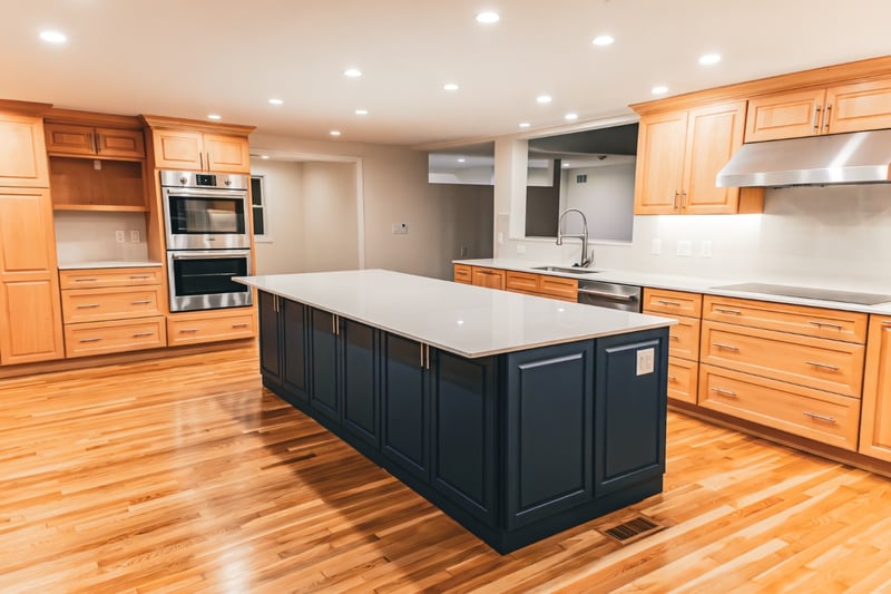 Large open kitchen remodel in Boston with black island by Honorato Company